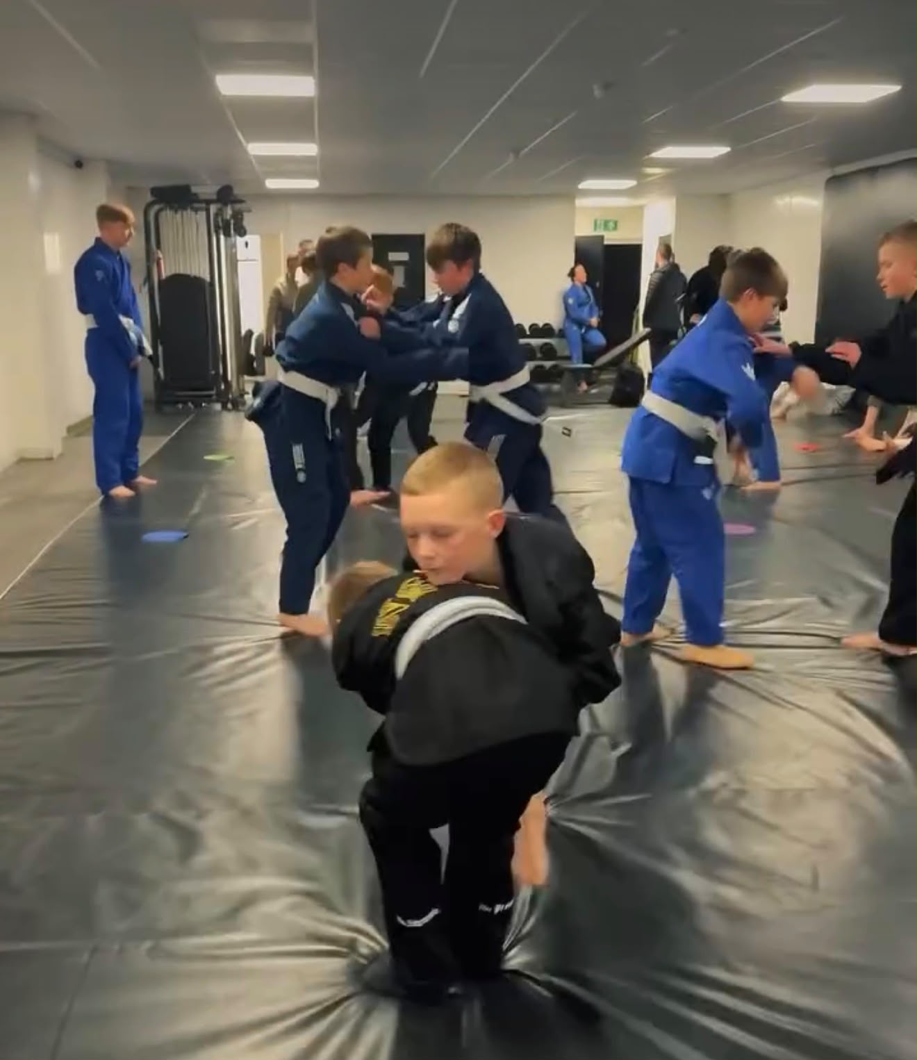 Kids drilling takedowns in gis at Training Grounds Maghull