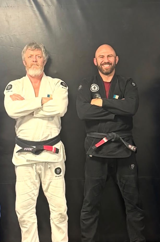 Training Grounds coaches Kevin McAlister and John Smith on the mats